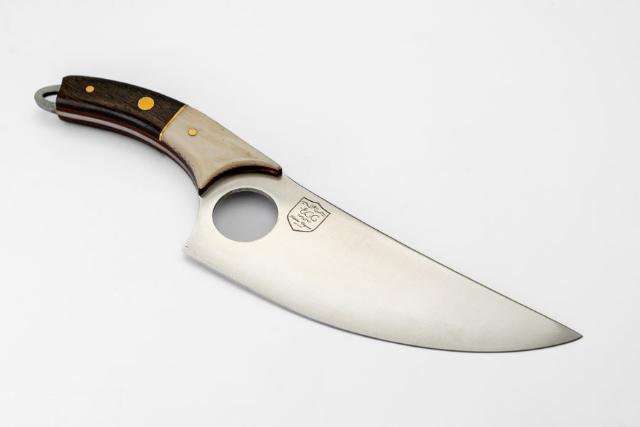Nabila Knife with a curved blade, round blade cutout and dark-and-cream handle